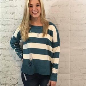 Blue and white striped distressed sweater with stars on the back. Brand new.